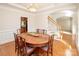 Formal dining room with large table, hardwood floors and chandelier at 5023 Ancestry Cir, Matthews, NC 28104