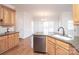 Kitchen features granite island, stainless steel appliances, and hardwood floors at 5023 Ancestry Cir, Matthews, NC 28104