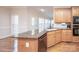 Spacious kitchen with granite countertops and oak cabinets at 5023 Ancestry Cir, Matthews, NC 28104