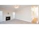 Living room features a marble fireplace and neutral carpeting at 5023 Ancestry Cir, Matthews, NC 28104