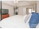 Main bedroom with a post bed, TV, and plenty of natural light at 5023 Ancestry Cir, Matthews, NC 28104