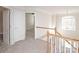 Upstairs hallway with access to bedrooms and stairs at 5023 Ancestry Cir, Matthews, NC 28104