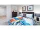 bedroom features a dinosaur themed bedspread, dresser and playful wall art at 5063 Beargrass Dr, Dallas, NC 28034