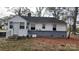 House backyard with gray brick base and wood chips at 5917 Peach St, Charlotte, NC 28269