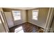 Corner bedroom showing two windows, new laminate flooring, and white trim at 5917 Peach St, Charlotte, NC 28269