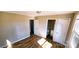 Bedroom with laminate flooring and access to the adjacent bathroom at 5917 Peach St, Charlotte, NC 28269