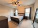 Bright bedroom with a double bed, nightstands, and ample natural light at 6022 Candlestick Ln, Lancaster, SC 29720