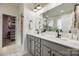 Modern bathroom with double vanity, gray cabinets, and a walk-in shower at 6142 Cloverdale Dr, Tega Cay, SC 29708