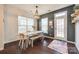 Bright dining area with hardwood floors and access to deck at 6142 Cloverdale Dr, Tega Cay, SC 29708