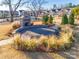 Outdoor community fireplace with seating and landscaping at 6142 Cloverdale Dr, Tega Cay, SC 29708