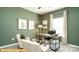 Home office with green walls and built in workspace at 6324 Honor Ave, Midland, NC 28107