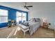 Bedroom with blue accent wall and white bedding at 6608 Brookgreen Ter, Matthews, NC 28104