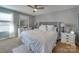 Main bedroom with plush bedding and large mirror at 6608 Brookgreen Ter, Matthews, NC 28104