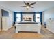 Spacious primary bedroom with a large bed, dresser, and ceiling fan at 6608 Brookgreen Ter, Matthews, NC 28104