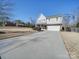 Two-story house with a large driveway and attached garage at 6608 Brookgreen Ter, Matthews, NC 28104