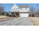 Two-story house with stone accents and a two-car garage at 6608 Brookgreen Ter, Matthews, NC 28104