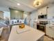 Kitchen island with quartz countertop and wood base at 6608 Brookgreen Ter, Matthews, NC 28104