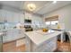 Modern kitchen with white cabinets and stainless steel appliances at 6608 Brookgreen Ter, Matthews, NC 28104