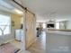 Laundry room with barn door and washer and dryer at 6608 Brookgreen Ter, Matthews, NC 28104