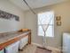 Laundry room features built-in shelving and a folding counter at 6608 Brookgreen Ter, Matthews, NC 28104