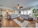 Open living room with hardwood floors and a view of the kitchen at 6608 Brookgreen Ter, Matthews, NC 28104