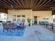 Covered patio with seating area, dining table, and ceiling fan at 6608 Brookgreen Ter, Matthews, NC 28104