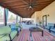 Relaxing covered patio features comfortable seating and a dining area at 6608 Brookgreen Ter, Matthews, NC 28104