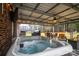 Hot tub on a covered patio with seating area at 6751 Lackey Rd, Vale, NC 28168