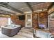 Hot tub on a covered patio with seating area at 6751 Lackey Rd, Vale, NC 28168