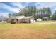 Brick ranch house with attached garage and landscaped yard at 6751 Lackey Rd, Vale, NC 28168