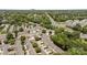 The aerial view features a neighborhood surrounded by trees and close to highways, showing convenience and accessibility at 7019 Walnut Ridge Ct, Charlotte, NC 28217