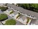 Overhead view showcases townhomes with attached garages, neatly manicured landscaping, and ample parking at 7019 Walnut Ridge Ct, Charlotte, NC 28217