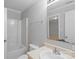 Cozy bathroom features a vanity and tub with shower, providing a functional and clean space at 7019 Walnut Ridge Ct, Charlotte, NC 28217