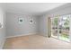 Spacious bedroom with neutral carpet and a sliding glass door to the outside at 7019 Walnut Ridge Ct, Charlotte, NC 28217