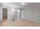 Bedroom boasts neutral walls, carpet, and access to an en-suite bathroom for added convenience at 7019 Walnut Ridge Ct, Charlotte, NC 28217