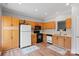 Functional kitchen with wood cabinets and appliances, showcasing a practical design at 7019 Walnut Ridge Ct, Charlotte, NC 28217
