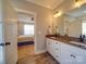 Well-lit bathroom with double vanity, granite countertop and bedroom access at 721 Red Spruce Dr, York, SC 29745