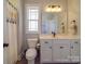 Nice bathroom with toilet, shower and white vanity at 721 Red Spruce Dr, York, SC 29745