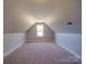 Bright bedroom with sloped ceilings and window at 721 Red Spruce Dr, York, SC 29745