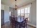 Dining room with dark wood table, chairs, and large windows at 721 Red Spruce Dr, York, SC 29745