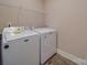 Convenient laundry room with Maytag washer and dryer, and overhead shelving at 721 Red Spruce Dr, York, SC 29745