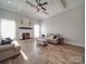 Spacious living room with hardwood floors, a fireplace, and comfy seating at 721 Red Spruce Dr, York, SC 29745