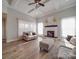 Bright living room boasts hardwood floors, a fireplace, and lots of windows at 721 Red Spruce Dr, York, SC 29745