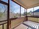 Relaxing screened porch with wooden deck and wooded views at 721 Red Spruce Dr, York, SC 29745