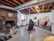 Unfinished basement with brick fireplace and storage at 7392 Reeps Grove Church Rd, Vale, NC 28168