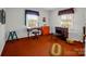 Cozy bedroom with two desks, orange dresser and carpet at 7392 Reeps Grove Church Rd, Vale, NC 28168