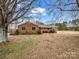 Ranch style brick home with mature trees and a large yard at 7392 Reeps Grove Church Rd, Vale, NC 28168