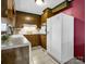 Kitchen features wood cabinets and white appliances at 7392 Reeps Grove Church Rd, Vale, NC 28168