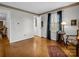 Bright living room with hardwood floors, window, and view to dining area at 7392 Reeps Grove Church Rd, Vale, NC 28168