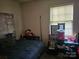 Bedroom with a bed, Route 66 poster, and window at 800 Thera Dr, Charlotte, NC 28206